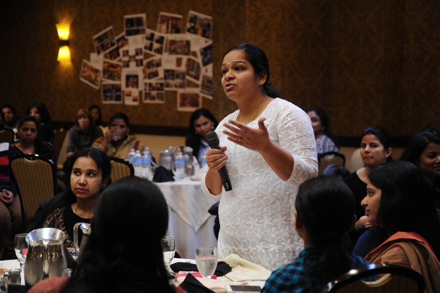 Indian professional speaking at a business promotion event